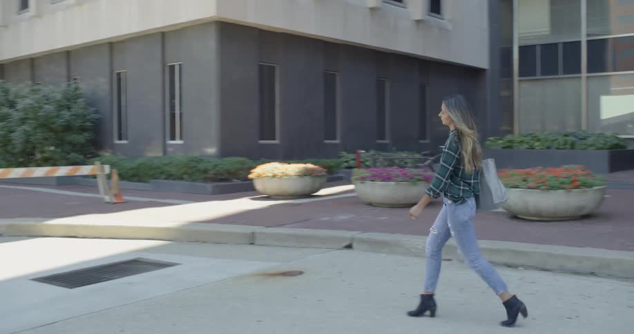 A woman leaves a building