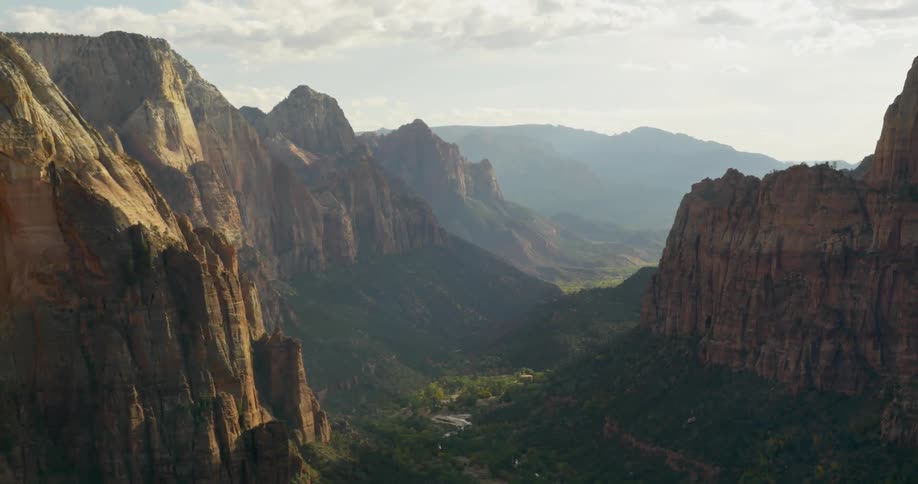 Aerial view of a forest between two mountains