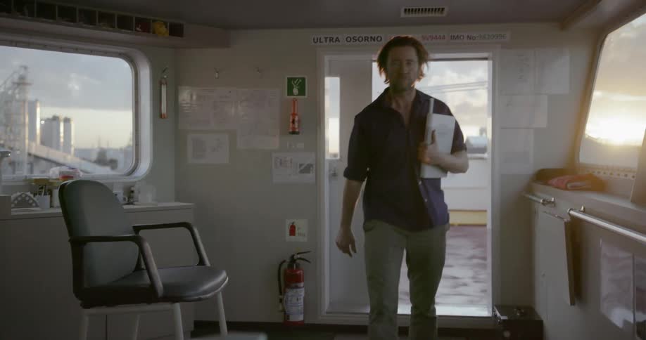 Man walks into enclosed area on a ship