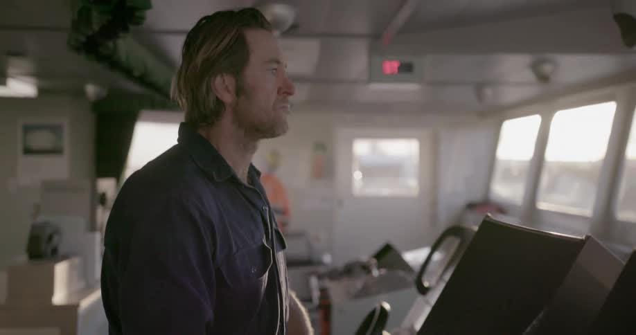 Man stands and types on a keyboard