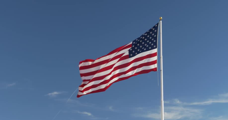 An american flag blows in the wind