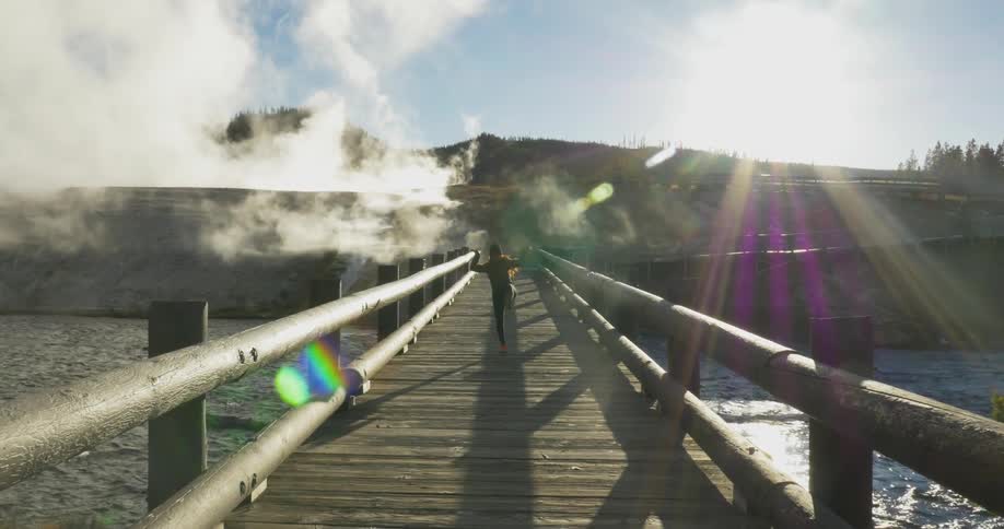 A person walking over a bridge