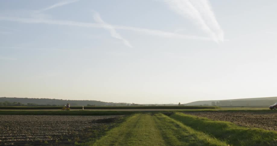 Person rides a bike down a flat country road