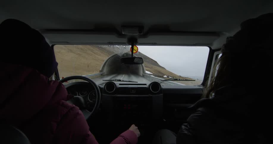 Person inside drives a vehicle on a road and into a tunnel