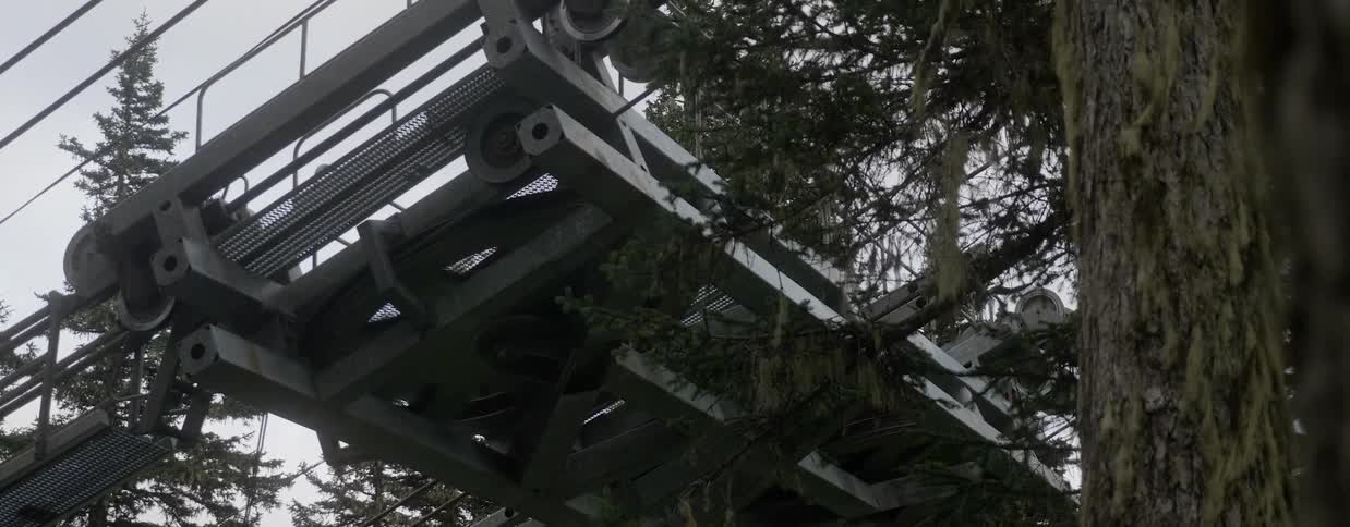 The fan on the metal railing is spinning