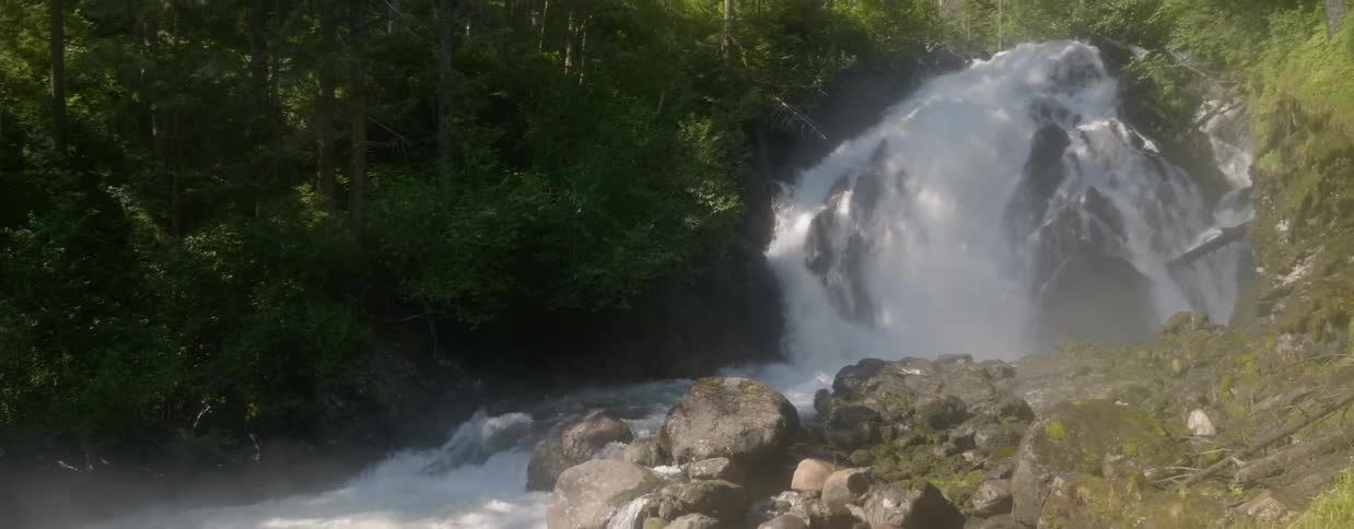Water cascades over rocks in a river