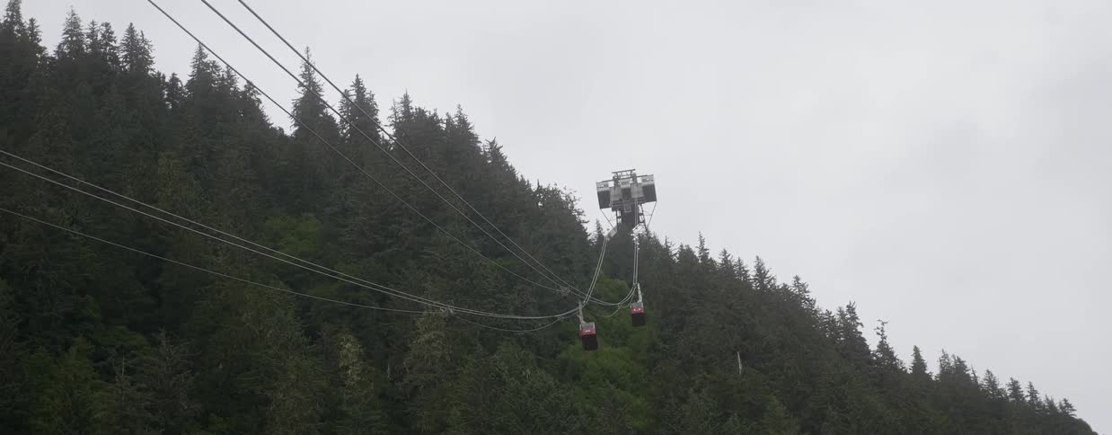 People travel along a mountain lift