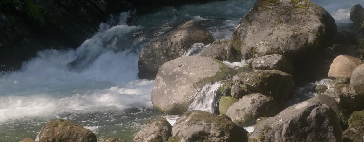 River water flows over boulders