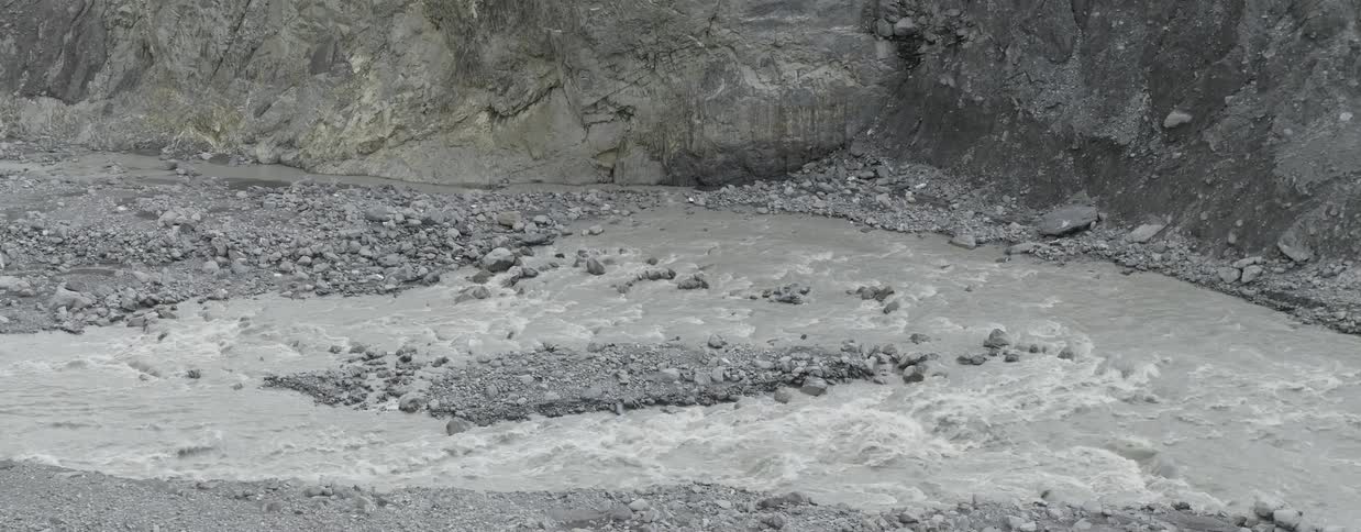 Water cascades over rocks in a river