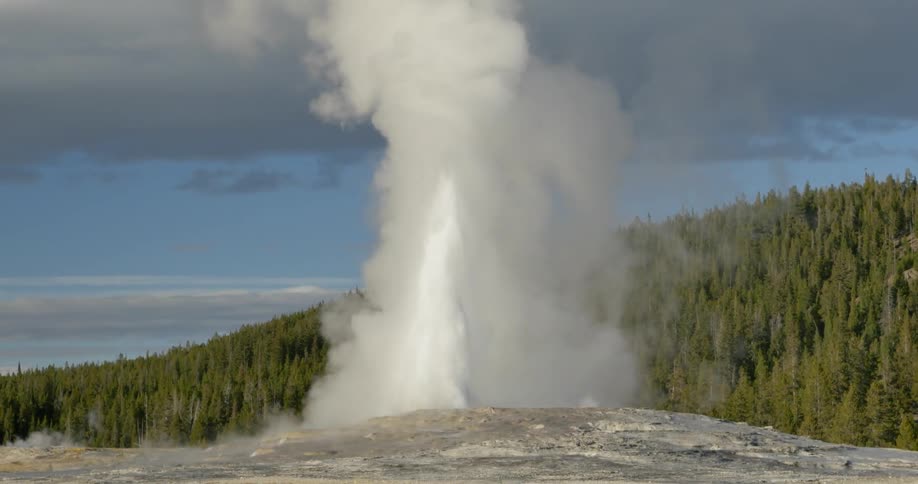 Water and smoke gush out of the ground into the air