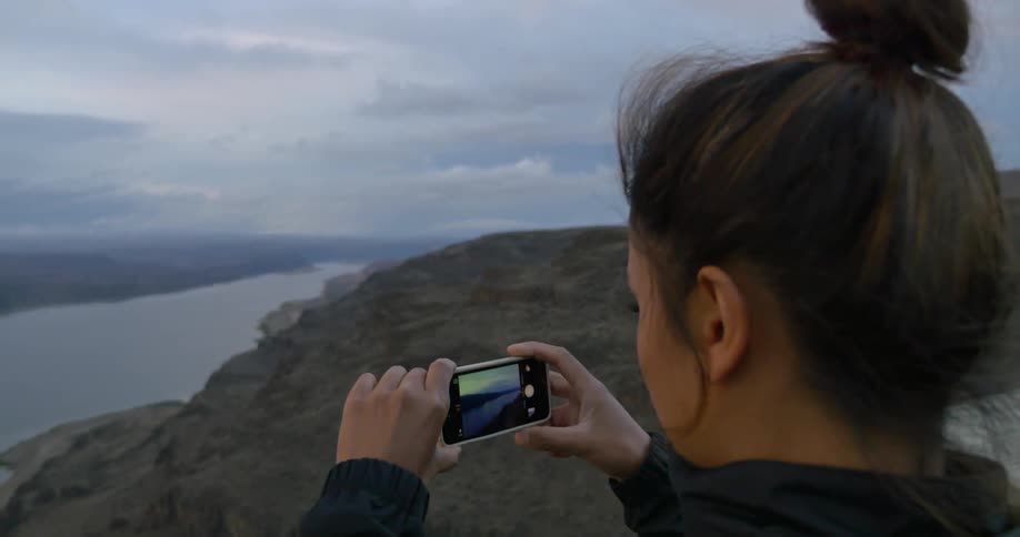 A person taking pictures of nature