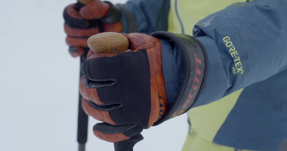 A man grabs hold of his ski poles