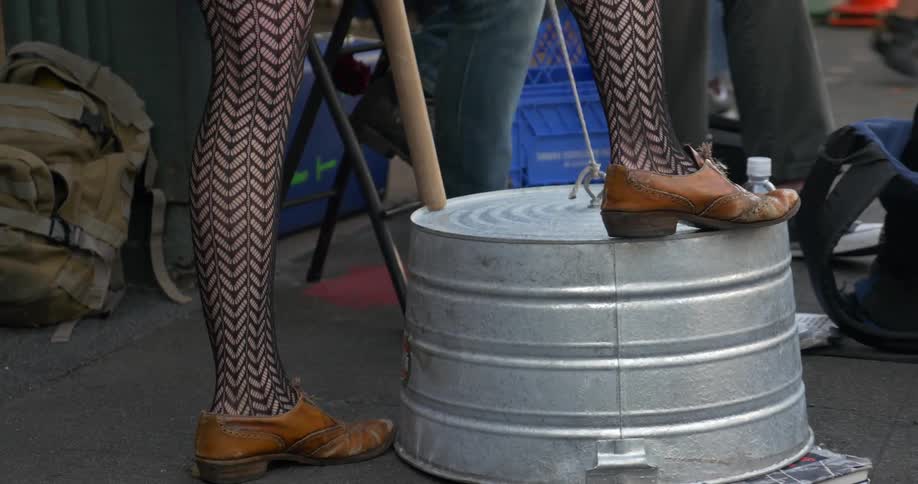 Sidewalk musicians keeping time with their feet