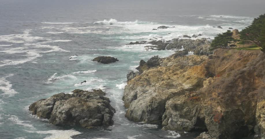 Waves crashing against rocks and cliffs