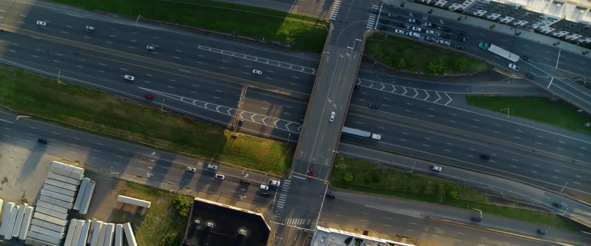 Cars drive on a city highway