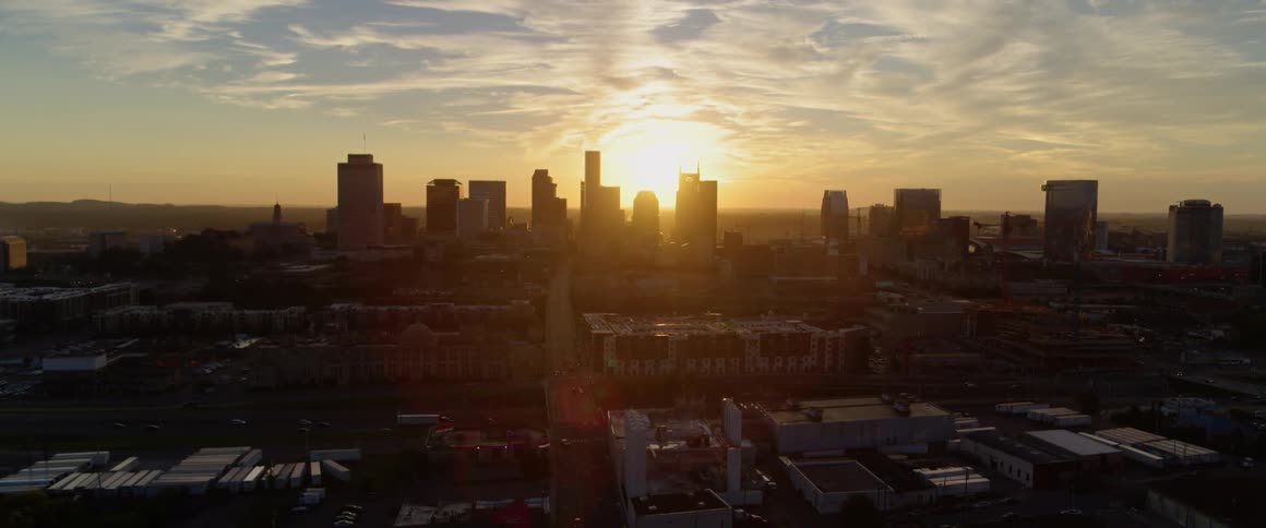 The sun rises over a large city