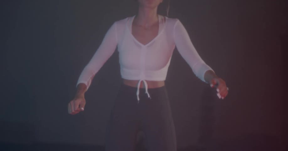 A woman exercises in a gym