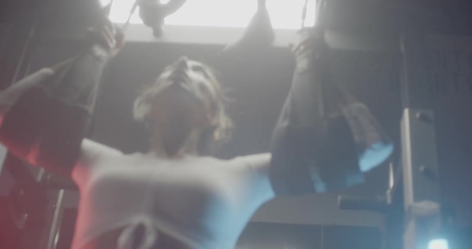A woman exercises in a gym