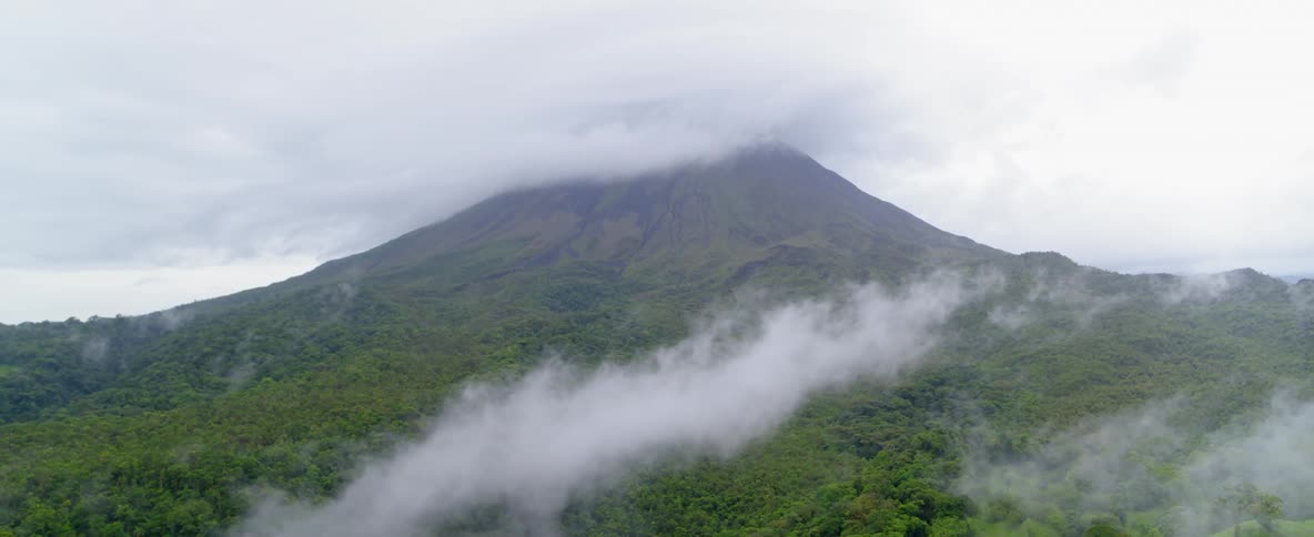 Clouds are forming around the top of a mountain