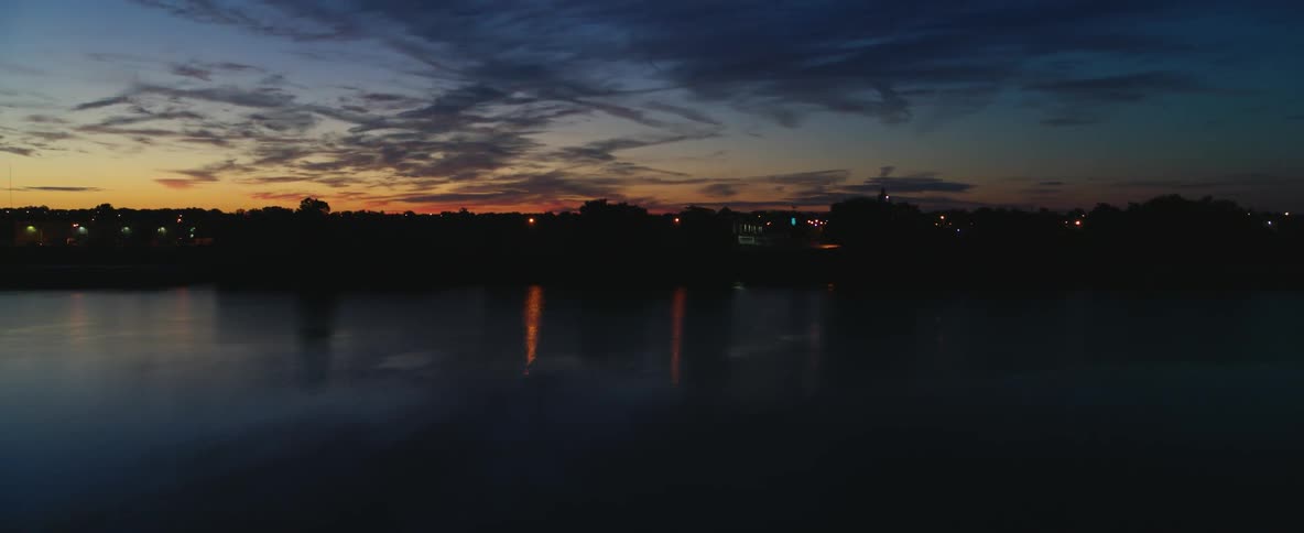 The sun is almost set behind this town ahead