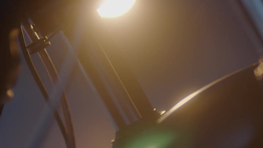 A light shines on parts of a motorcycle