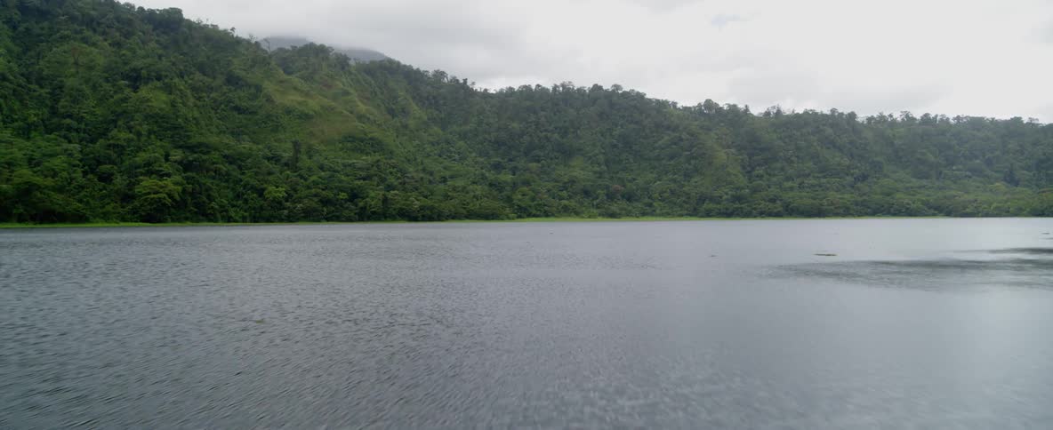 Water flows gently in a river on an overcast day
