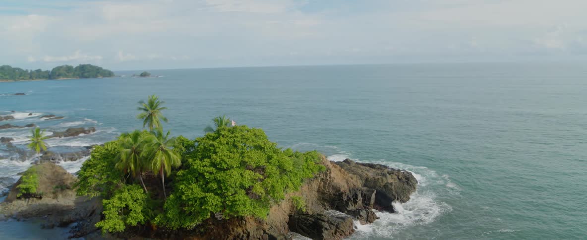 Waves are crashing on a small island
