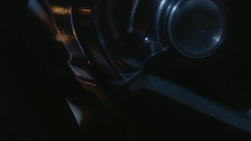 A close up of the headlight to a motorcycle