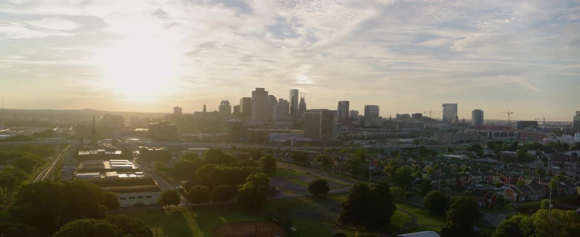 The sun is slowly setting on a large city