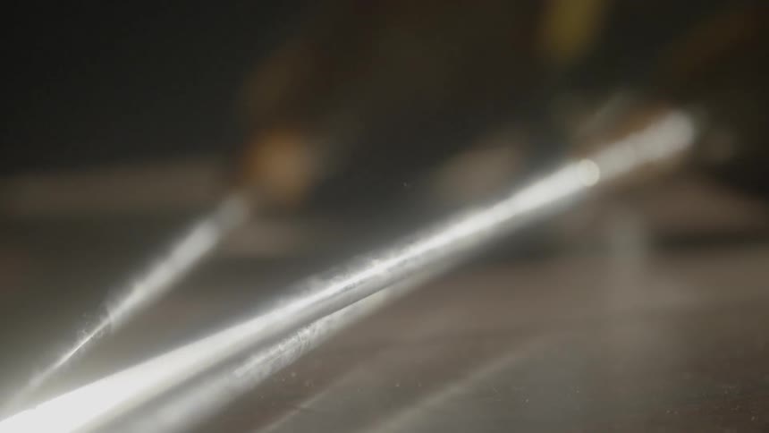 A close up of shiny golf clubs