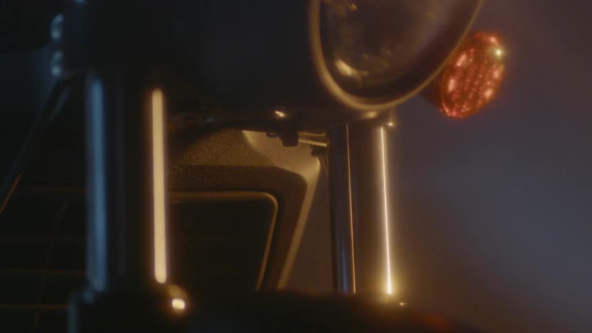 A close up of the wheel and frame of a motorcycle