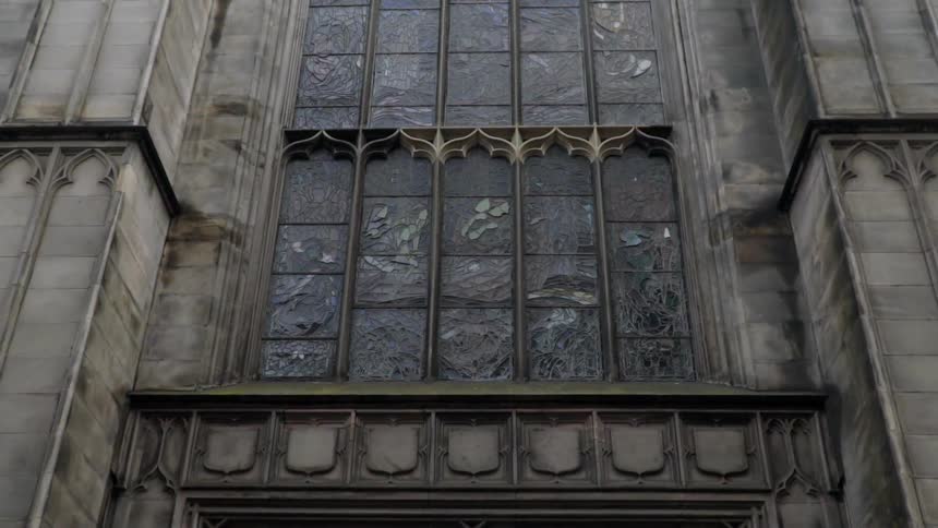 The building is tall with many windows