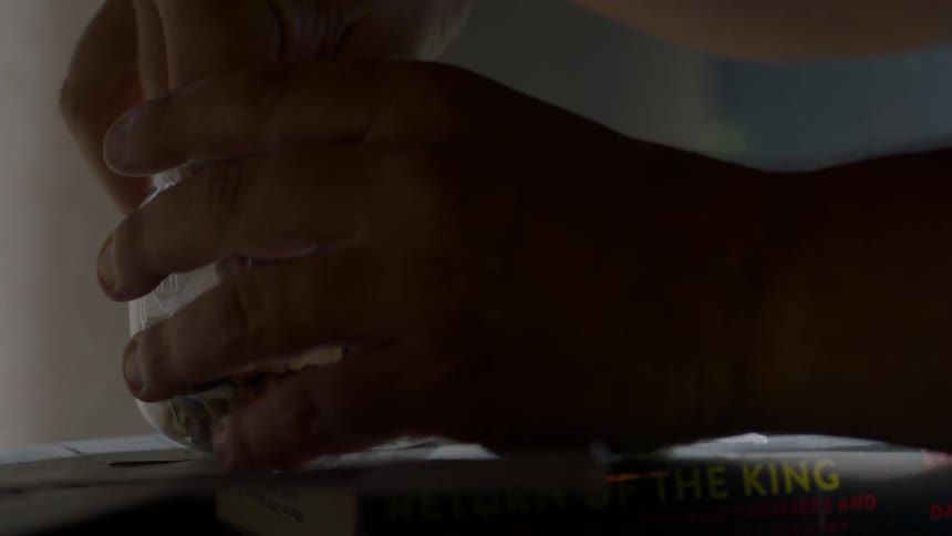 A person removes some tacks from a jar