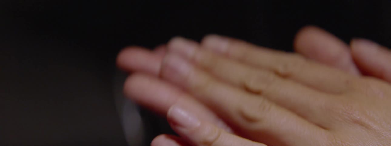 Hands rubbing together in a wringing fashion