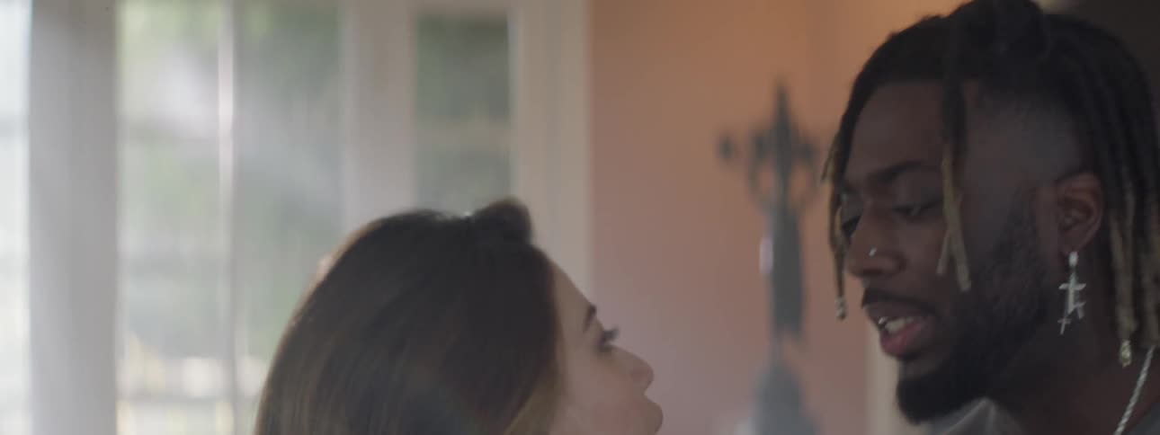 A woman and a man are arguing in a house