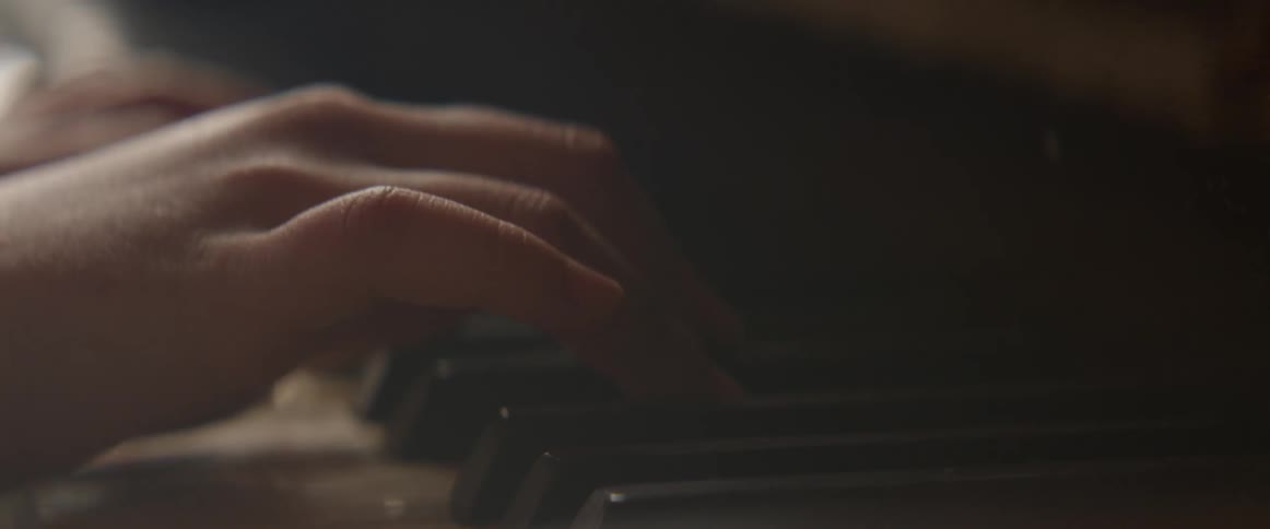 A pianist plays the piano