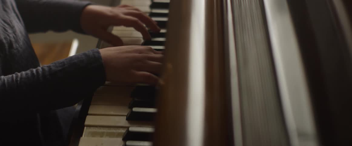 A person plays piano
