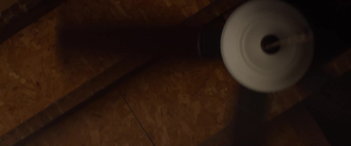 A ceiling fan spins on a ceiling