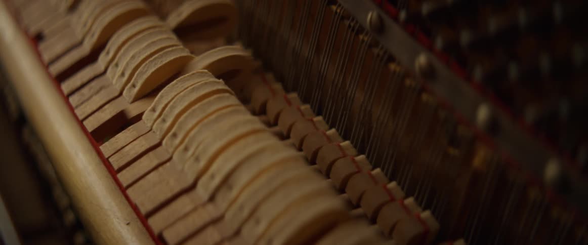 The inside of a piano while it's played