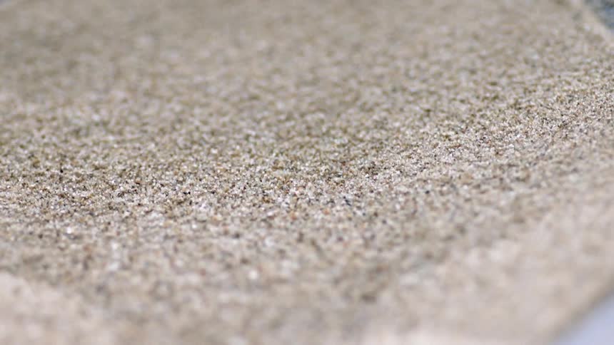 Sand is vibrating in a machine