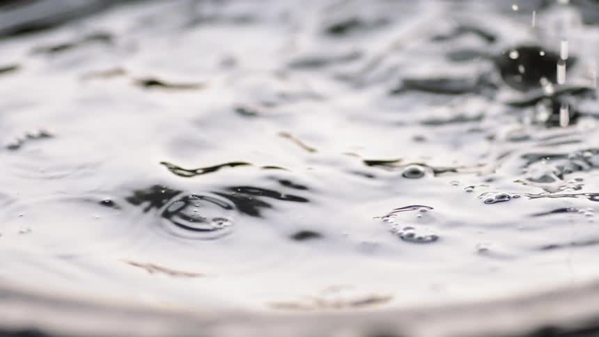 Water pouring into a bucket