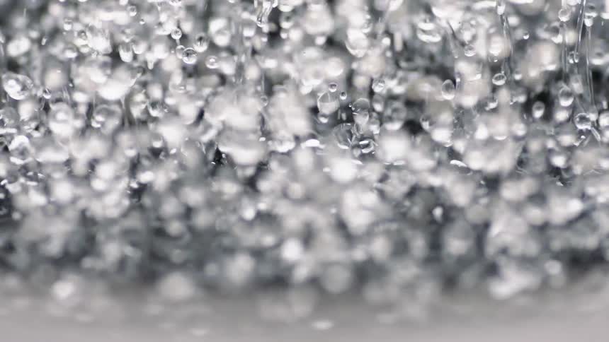 Drops of liquid jump up and shimmer