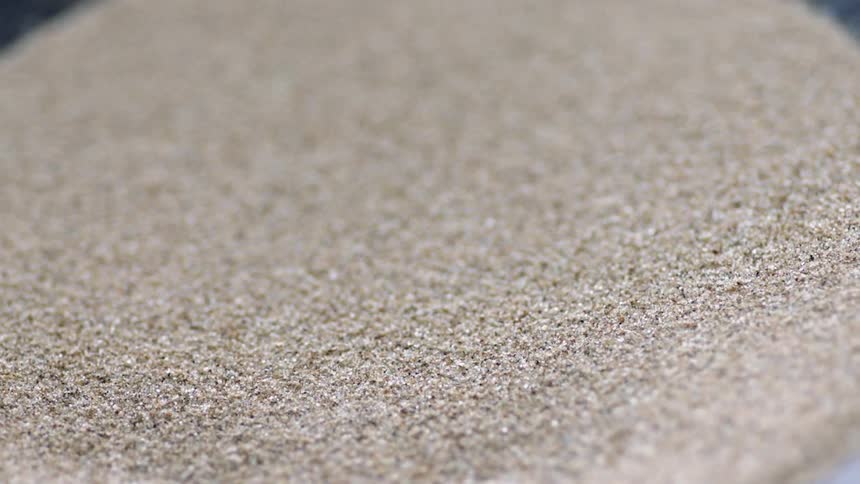 The speaker is slowly vibrating the sand