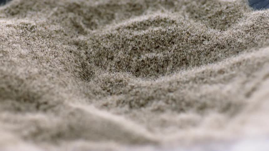 Sand particles bounce and vibrate