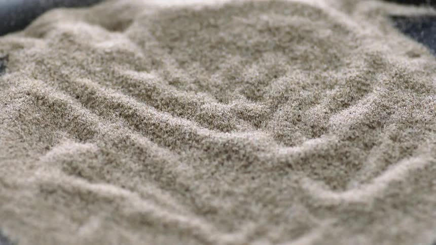 The speaker vibrates the sand
