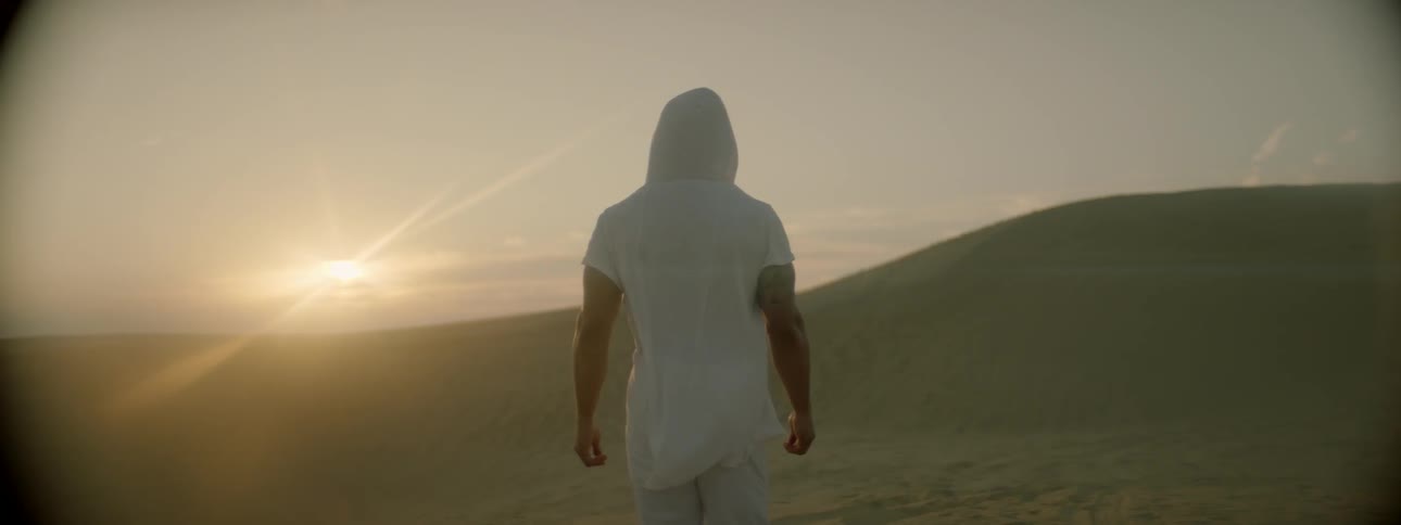 A man walks through the desert