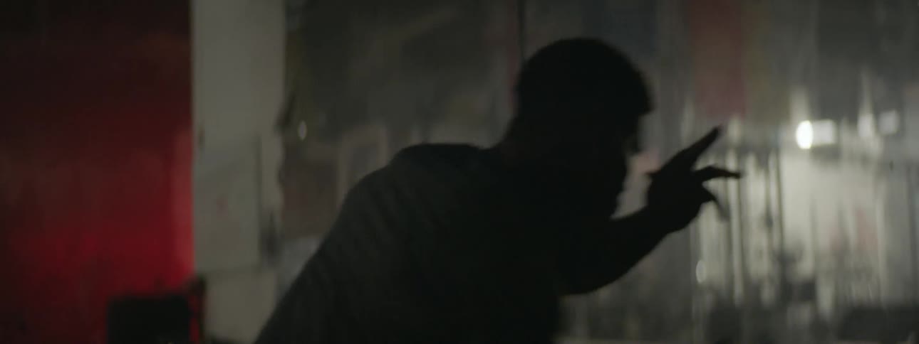 A fighter is going through his moves in a gym