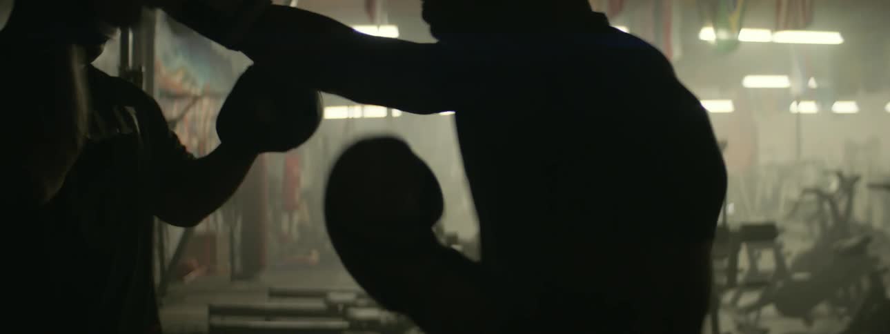 Boxers spar in a gym