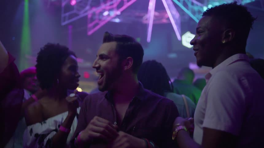 People dance in a club
