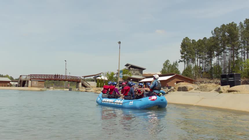 People row the raft from the shore